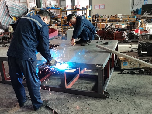 Welding, joining, and strengthening the main frame of the machine